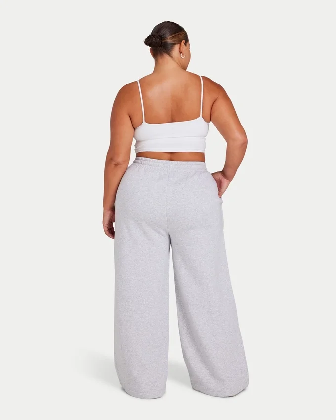 Pantaloni sportivi da donna Collective a gamba larga – grigio melange Pantaloni sportivi da donna Collective a gamba larga – grigio melange