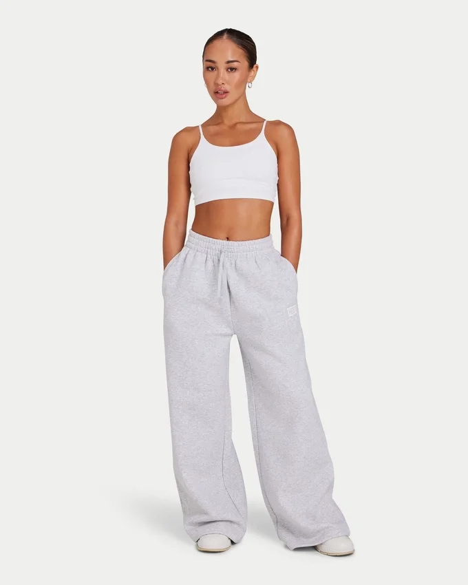 Pantaloni sportivi da donna Collective a gamba larga – grigio melange Pantaloni sportivi da donna Collective a gamba larga – grigio melange